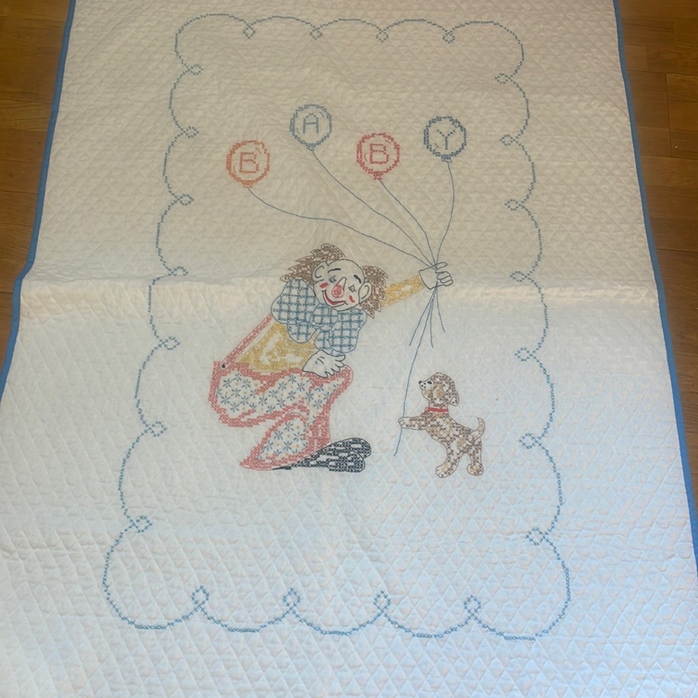 Embroidered crib quilt